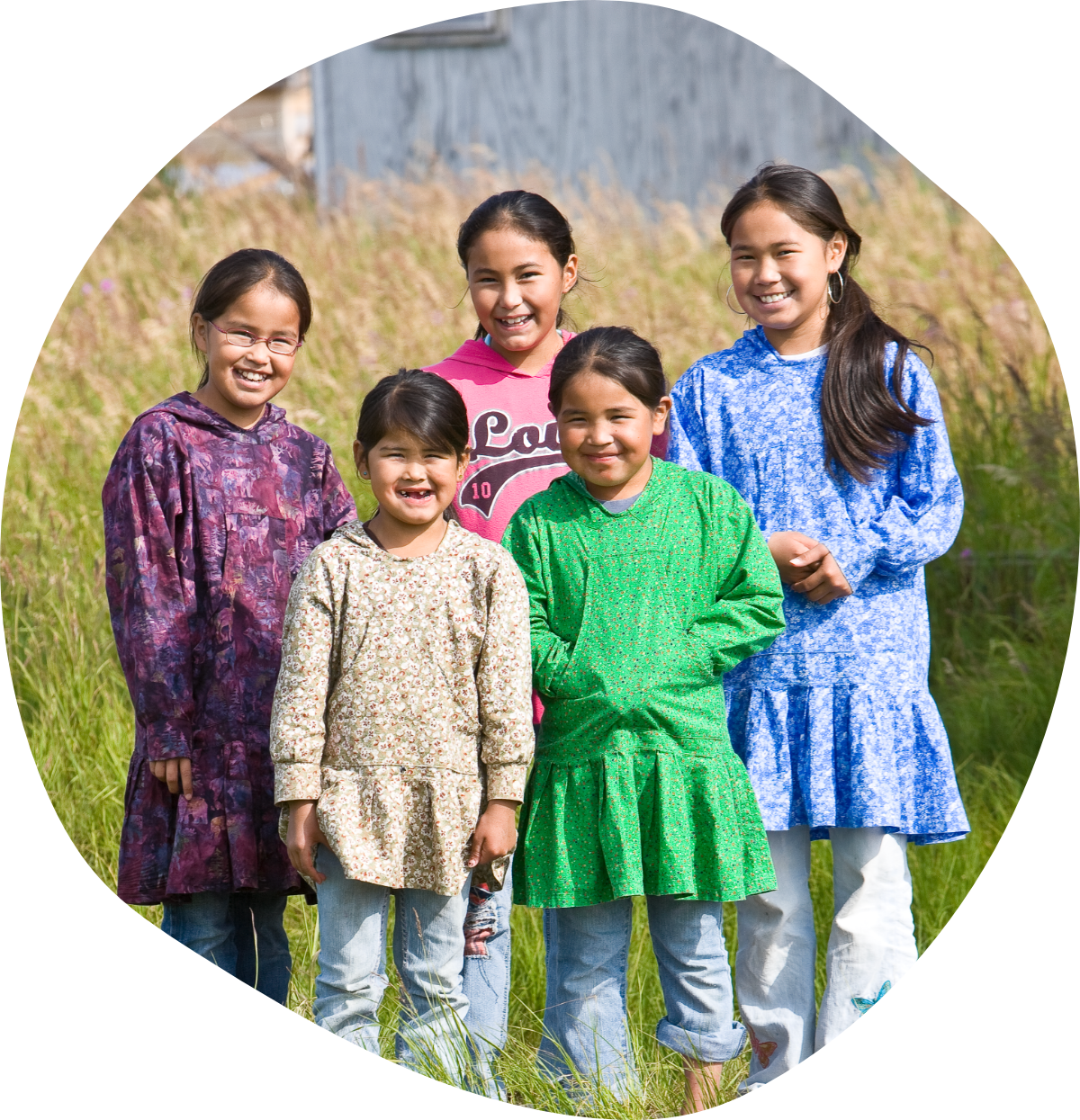 Five Iñupiat children in colorful outfits